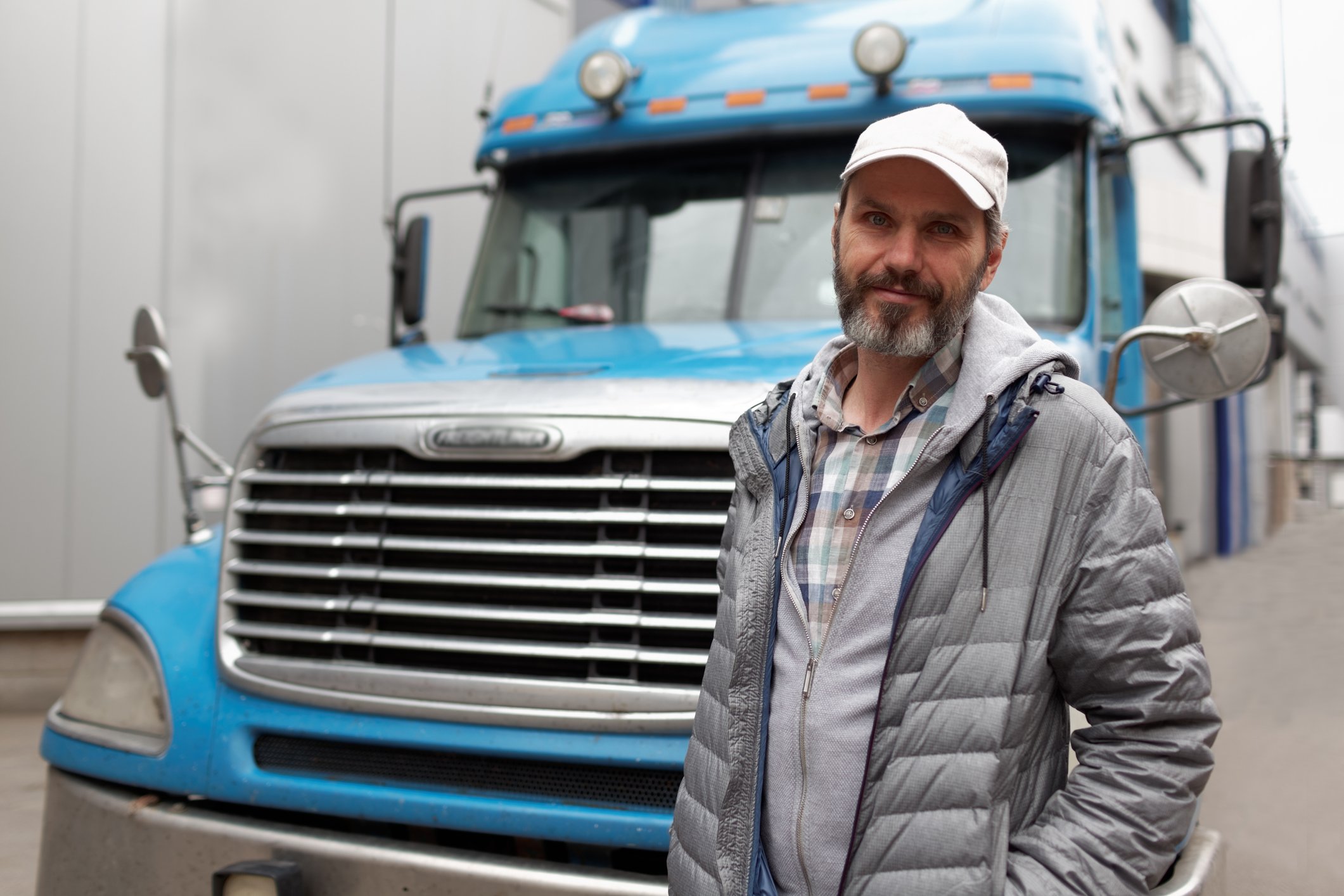 CDL Driver leaning against big rig ORDP covers CDL Drivers like you
