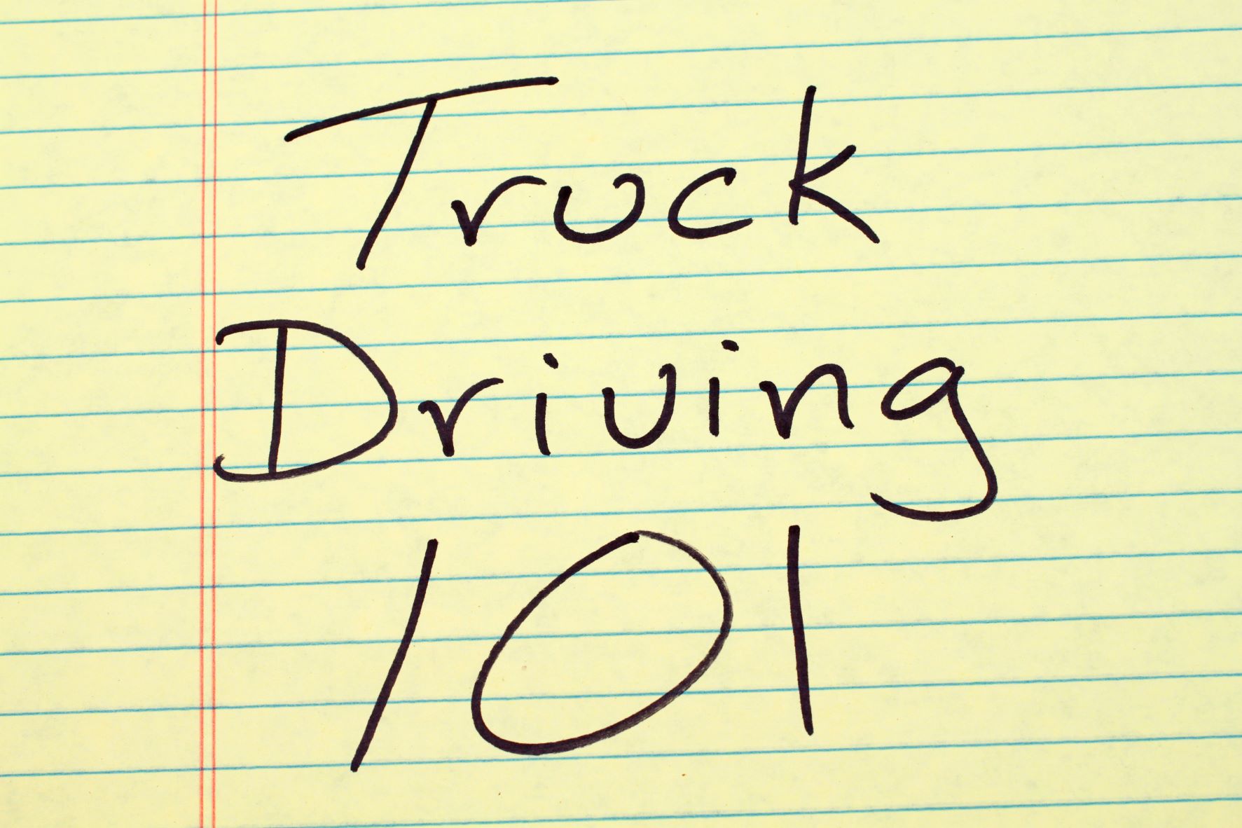 Sheet of yellow notebook paper saying truck driving 101 for truck driver safety training
