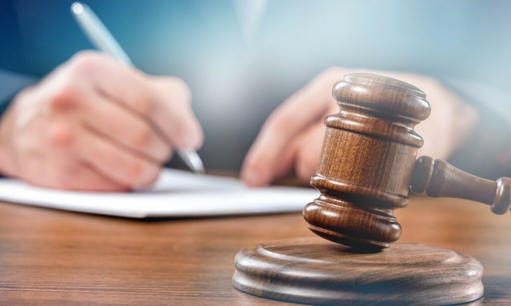 Gavel and notepad on desk