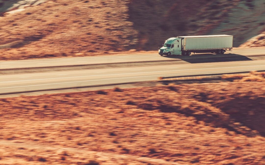 Semi driving on desert road